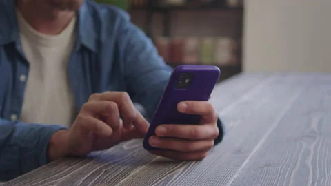 A handsome man is typing something on the phone Stock Footage 170204463