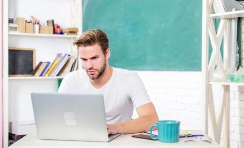 Handsome man use modern technology. Improve knowledge. Programming web 写真素材