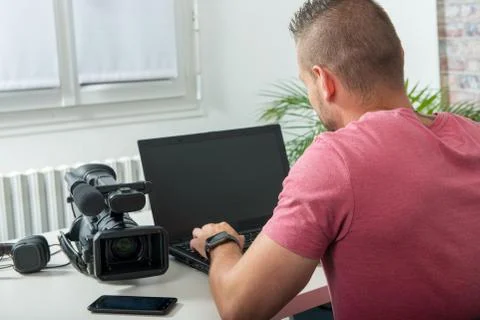 Handsome man using a computer in the office Stock Photos
