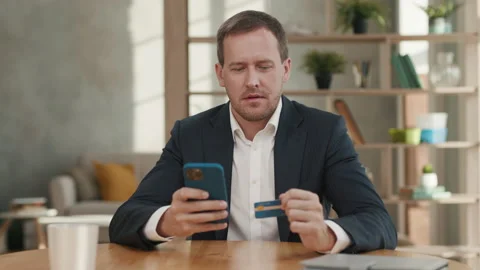 Handsome Man Using Credit Card for Online Shopping on Smartphone Close up Stock Footage 167022008