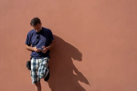 Handsome Man Using his Mobile Phone on a sunny day Stock Photos