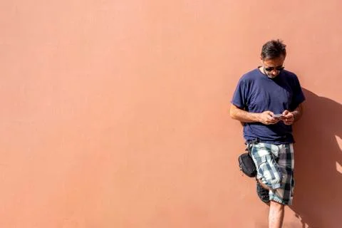 Handsome Man Using his Mobile Phone on a sunny day Stock Photos