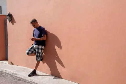 Handsome Man Using his Mobile Phone on a sunny day Stock Photos