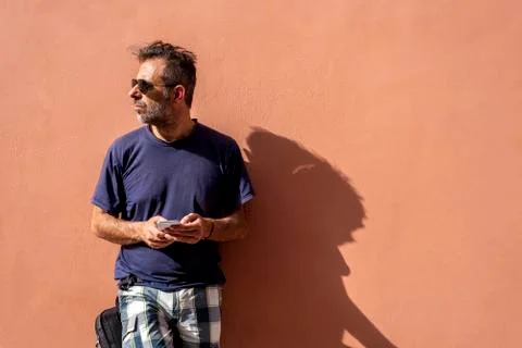 Handsome Man Using his Mobile Phone on a sunny day Stock Photos