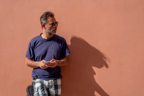 Handsome Man Using his Mobile Phone on a sunny day Stock Photos
