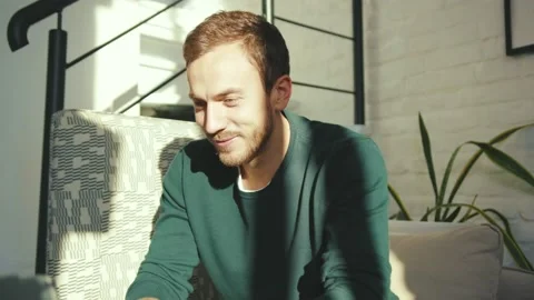 Handsome man using laptop feel happy working from home in internet smiling Stock Footage 132539472