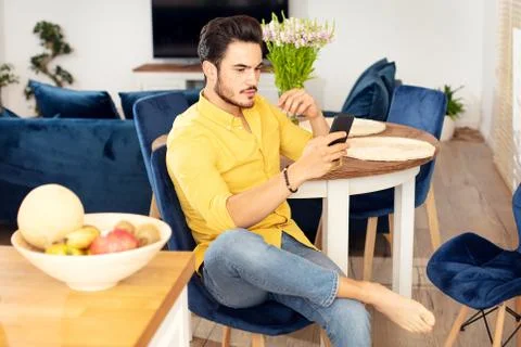 Handsome man using mobile phone. Stock-Fotos