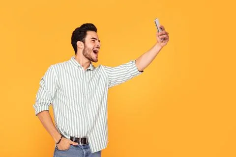 Handsome man using mobile phone. Stock-Fotos