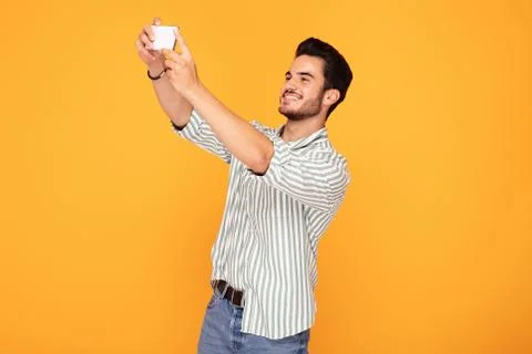 Handsome man using mobile phone. Stock-Fotos