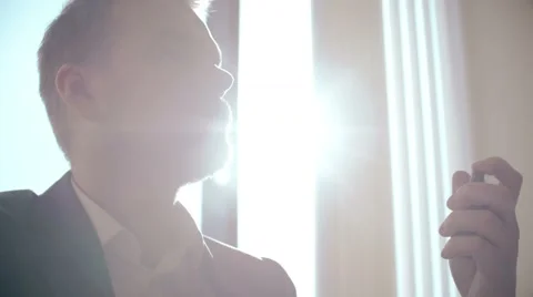 Handsome man using perfume and look into camera. fragrance fashion cosmetic Stock-Footage 61508931