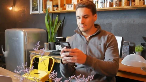 Handsome man using smartphone Video stock 117992933