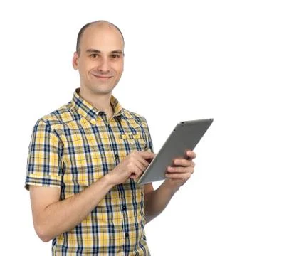 Handsome man using a tablet computer Stock Photos