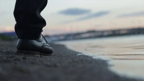 Handsome man walking on the beach Stock Footage 81447859