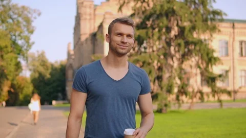 Handsome man walking in sunny day Stock Footage 101484677