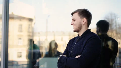Handsome man was waiting for his girlfriend and is really happy to see her Stock Footage 61832788