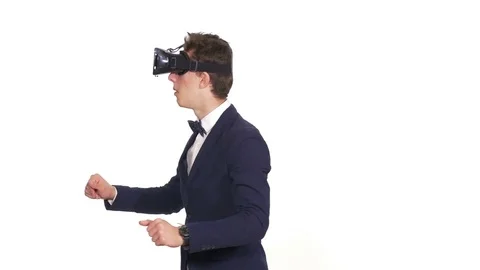 Handsome man wearing future technology virtual reality glasses Stock Footage 71440365