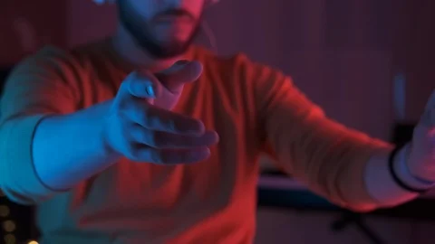 Handsome man wearing virtual reality headset. Closeup hand movements. 3D vr Stock Footage 126586560