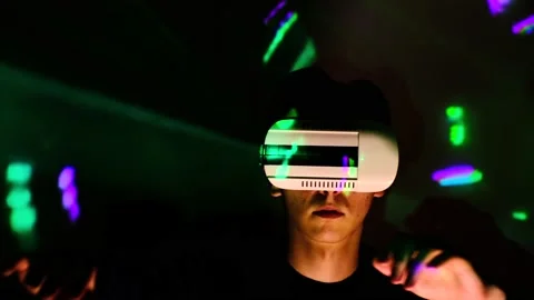 Handsome man wearing virtual reality headset. Augmented Reality. Man touch Stock Footage 130176360