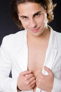 Handsome man in white jacket Stock Photos