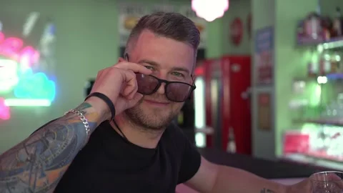 Handsome Man Winks In Camera, Smiling And Flirting in Cafe Stock Footage 157292586