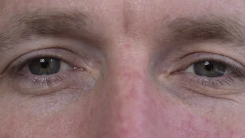 A handsome man winks with one eye while looking straight into the camera. Stock Footage 275353106