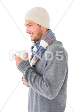 Handsome man in winter fashion holding mug Stock-Fotos