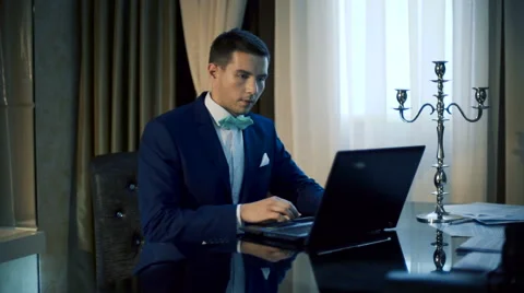 Handsome man working on laptop Video stock 62828911