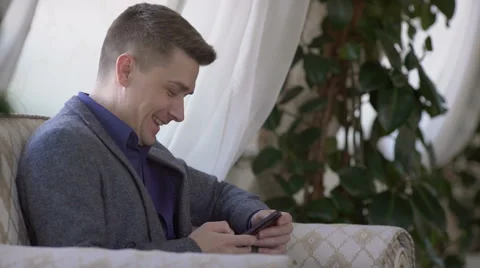 Handsome man working with smartphone and documents Stock Footage 60952140