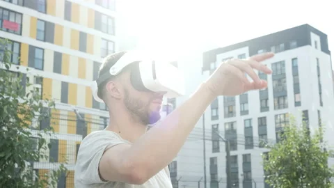 Handsome man working in vr glasses. Man using virtual reality headset. Stock Footage 94057692