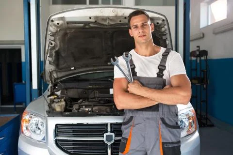 Handsome mechanic in a workshop Stock Photos