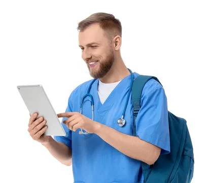 Handsome medical intern using tablet computer on white background Stock Photos