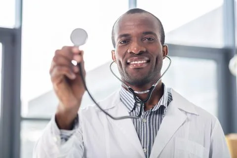 Handsome medical worker posing on camera Stock Photos