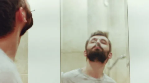 Handsome men with beard behind the mirrow and smoking Video stock 60232407