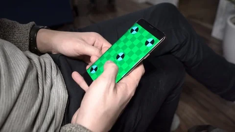 Handsome men at home using smartphone. Handsome men using digital display touch Stock Footage 102225050