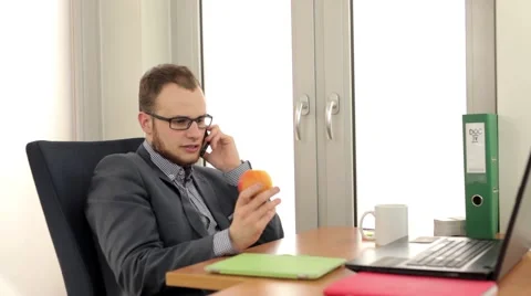 Handsome men sitting behind the desk and talking by the phone (27) 스톡 동영상 49339366