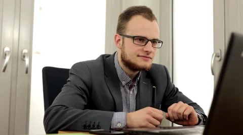 Handsome men in suit sitting behind the desk (33) Stock Footage 49339686