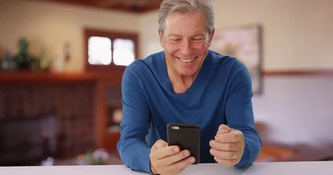 Handsome mid aged man making phone call with cellphone Stock Footage 70461971