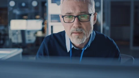 Handsome Middle Aged Engineer Wearing Glasses Works on Personal Computer. Stock-Footage 104951509