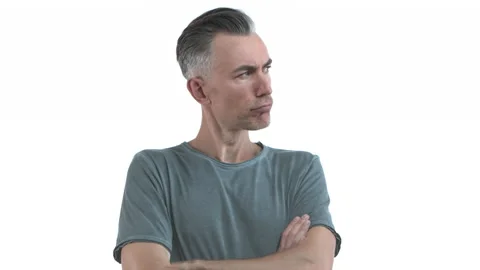 Handsome middle-aged man with grey hair and bristle, react to someone talking Video stock 140064380