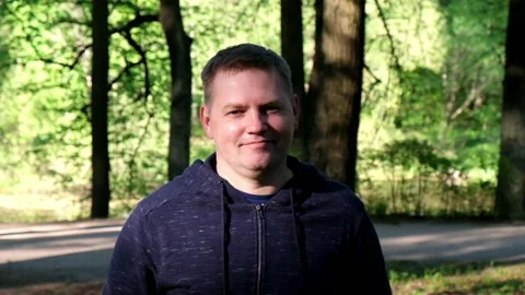 Handsome middle aged man looking at camera and smiling Stock Footage 89659514