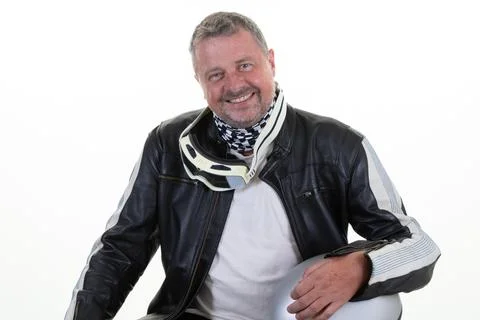 Handsome middle aged man sit with motorcycle helmet wearing leather black m.. Stock Photos