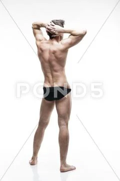 Handsome muscular bodybuilder posing on white background. Isolated studio sho Stock Photos