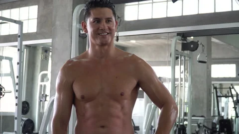 Handsome muscular man take a break after Training in fitness gym motivation a Stock Footage 162811167