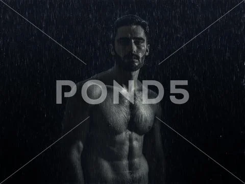 Handsome muscular shirtless young man wet in the rain Stock Photo ...