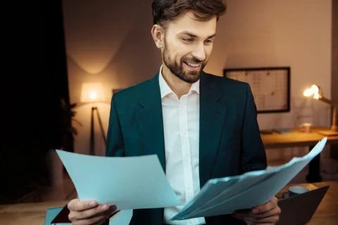 Handsome office worker doing his job with pleasure Stock Photos