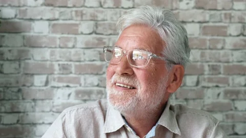 Handsome older man smiling staring at camera feels happy, close up face vie.. Stock Footage 236928565