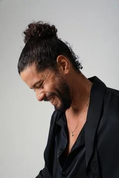 Handsome optimistic man posing indoor. Mind set and mental health. Fotos Stock