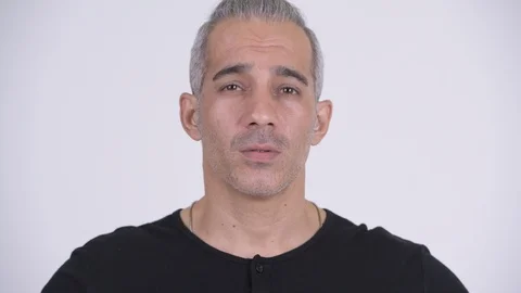 Handsome Persian man covering ears as three wise monkeys concept Video stock 101017906