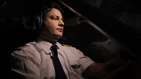 Handsome pilot flying plane, flirting with dispatcher over radio, enjoying work Stock Footage 65118142