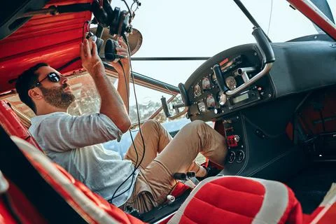A handsome pilot prepares for take off Stock Photos